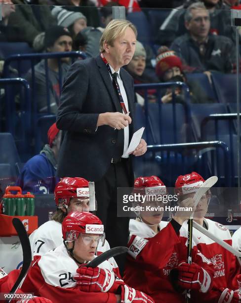 Denmark head coach Olaf Eller on the bench in the second period against Finland during the IIHF World Junior Championship at KeyBank Center on...