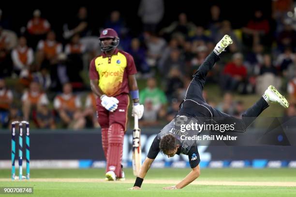 Trent Boult of the New Zealand Black Caps fields the ball during game three of the Twenty20 series between New Zealand and the West Indies at Bay...