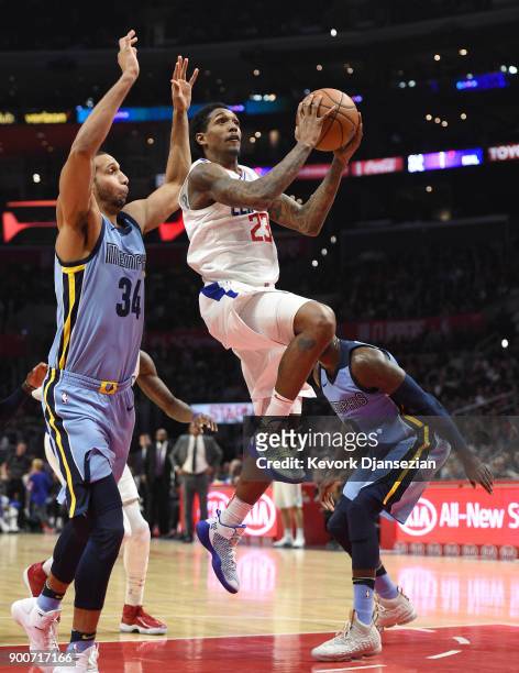 Lou Williams of the Los Angeles Clippers goes for a layup against Brandan Wright of the Memphis Grizzlies during the first half at Staples Center on...