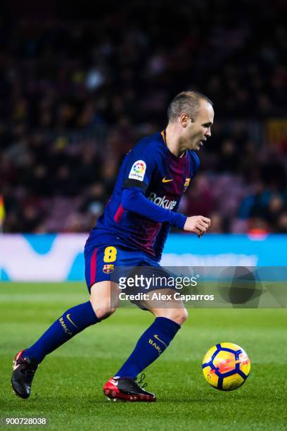 Andres Iniesta of FC Barcelona conducts the ball during the La Liga match between FC Barcelona and Deportivo La Coruna at Camp Nou on December 17,...