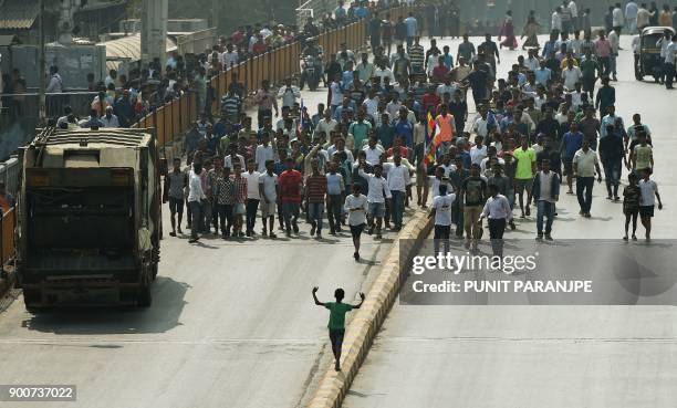 Republican Party of India supporters walk during a protest in the streets of Mumbai on January 3, 2018. India's Republican Party supporters took part...