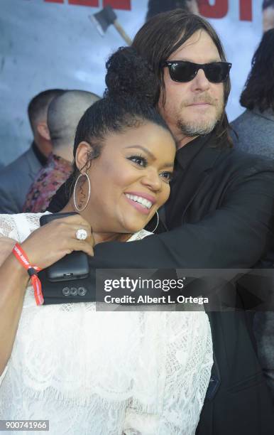 Actress Yvette Nicole Brown and actor Norman Reedus arrive for the AMC Celebrates The 100th Episode Of "The Walking Dead" held at The Greek Theatre...