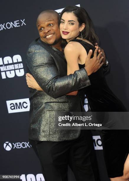 Actor Iron E. Singleton and TV Personality Leanna Vamp arrive for the AMC Celebration of The 100th Episode Of "The Walking Dead" held at The Greek...