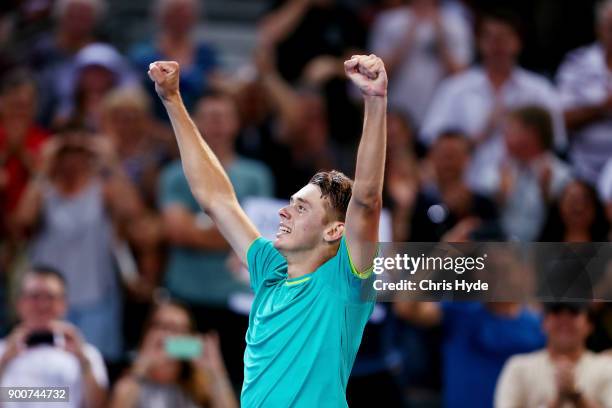 Alex De Minaur of Australia celebrates winning his match against Milos Raonic of Canada during day four of the 2018 Brisbane International at Pat...