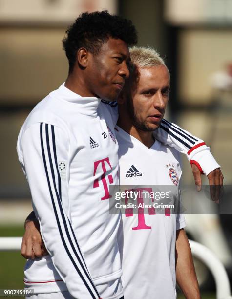 David Alaba and Rafinha arrive for a training session on day 2 of the FC Bayern Muenchen training camp at ASPIRE Academy for Sports Excellence on...