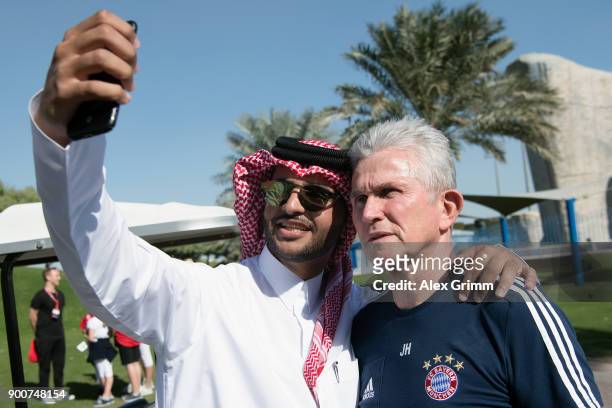 Head coach Jupp Heynckes poses for selfies during a training session on day 2 of the FC Bayern Muenchen training camp at ASPIRE Academy for Sports...