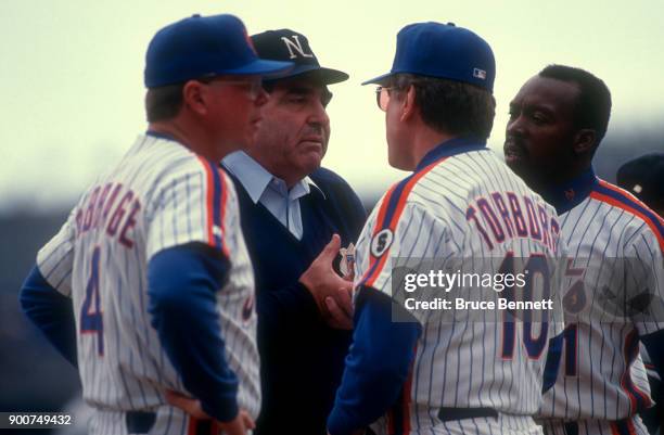 Manager Jeff Torborg, first base coach Mike Cubbage and Vince Coleman of the New York Mets argue with umpire Bob Davidson during an MLB game against...