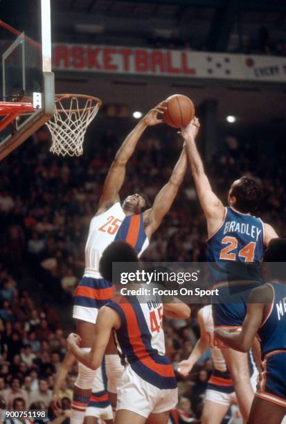 Gus Johnson of the Baltimore Bullets fights for a rebound with Bill Bradley of the New York Knicks during an NBA basketball game circa 1972 at the...
