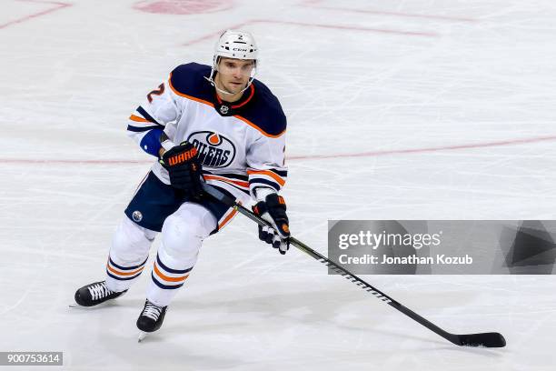 Andrej Sekera of the Edmonton Oilers keeps an eye on the play during third period action against the Winnipeg Jets at the Bell MTS Place on December...