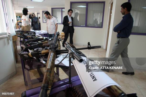 Weapons allegedly confiscated from the Jundallah Sunni rebel group are displayed at a government building in Iran�s restive southeastern city of...