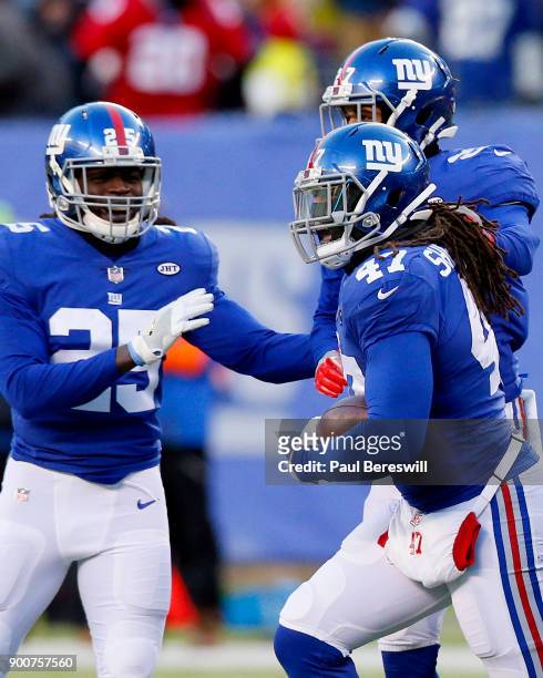 Kelvin Sheppard of the New York Giants celebrates intercepting a pass in an NFL football game against the Washington Redskins on December 31, 2017 at...