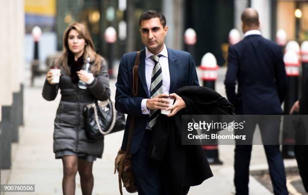 Arif Hussein, a former UBS Group AG trader, center, arrives to challenge a decision by the Financial Conduct Authority to ban him from the finance...