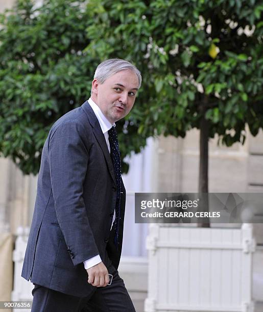 Head of the French bank merging Banque Populaire and Caisses d'Epargne Francois Perol arrives, on August 25 at the Elysee Presidential Palace, in...