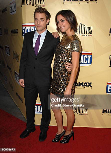 Dustin Milligan and Jessica Stroup arrives at the Los Angeles premiere of "Extract" at the ArcLight Hollywood on August 24, 2009 in Hollywood,...