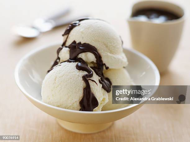 vanilla ice cream with chocolate sauce - vanilla ice cream stock pictures, royalty-free photos & images