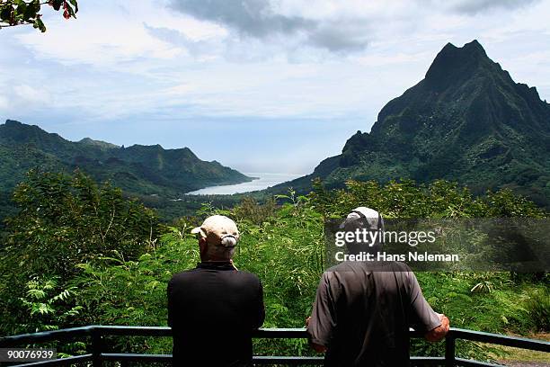 two men viewing moorea, tahiti - moorea stock pictures, royalty-free photos & images