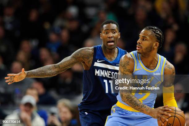 Jamal Crawford of the Minnesota Timberwolves defends against Vander Blue of the Los Angeles Lakers during the game on January 1, 2018 at the Target...