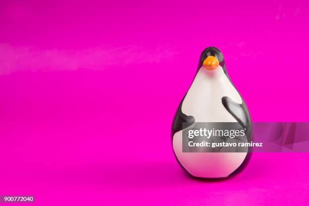 fat ceramic penguin - toy animal stock photos et images de collection