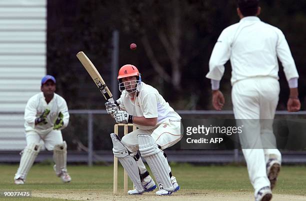 Dutch Wesley Barrisi avoids the ball of Hameed Hassan as Mohammed Shehzad looks on during the second day of the International Cup cricket event in...