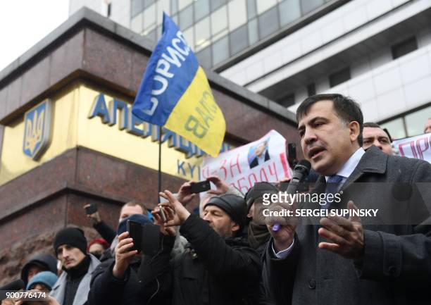 Former Georgian president Mikheil Saakashvili speaks to his supporters after attending his appeal hearing at a courthouse in Kiev on January 3, 2018....
