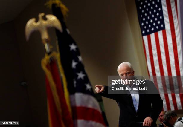 Sen. John McCain takes a question from a person in the crowd as speaks about health care reform during a town hall meeting at Grace Bible Church...