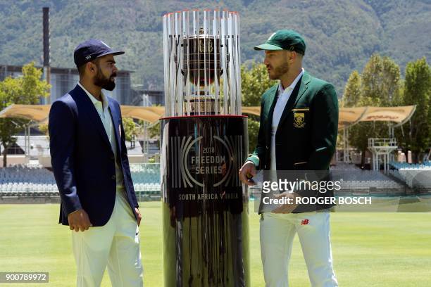 India's captain Virat Kohli and South Africa's captain Faf du Plessis pose with the 2018 Freedom Series trophy, which will be won by the winner of...