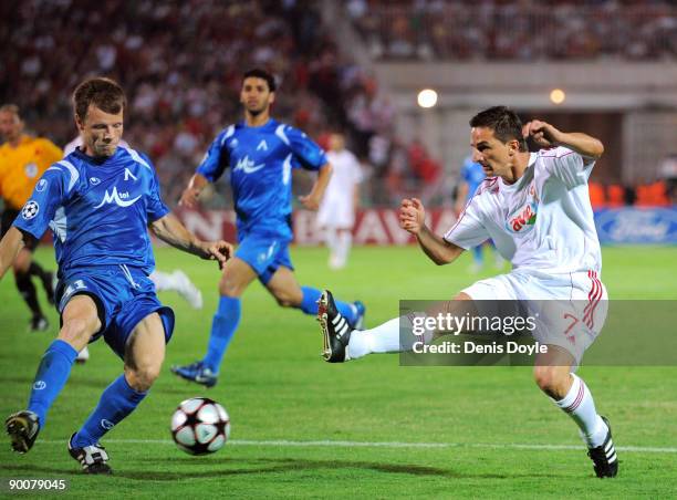 Tibor Dombi of Debreceni VSC has a shot at goal blocked during the UEFA Champions League Qualifier at the Puskas Ferenc stadium on August 25, 2009 in...