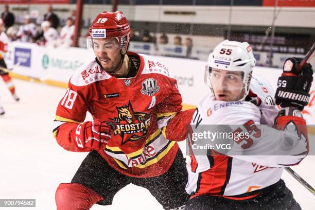 Brandon Yip of HC Kunlun Red Star and Egor Martynov of Avangard Omsk compete during the 2017/18 Kontinental Hockey League Regular Season match...