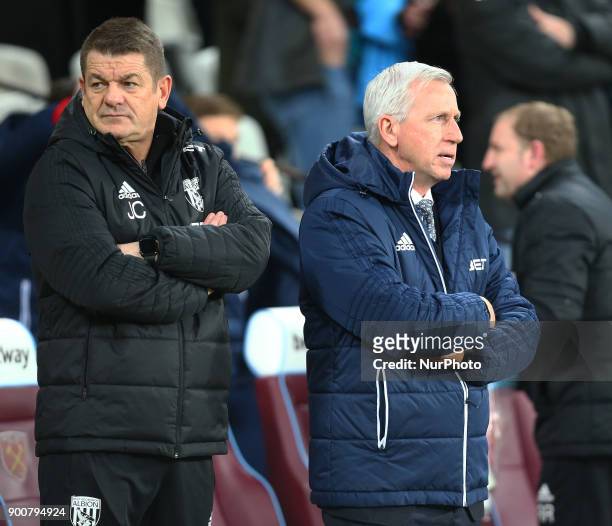Assistant Coach John Carver and West Bromwich Albion manager Alan Pardew during Premier League match between West Ham United against West Bromwich...