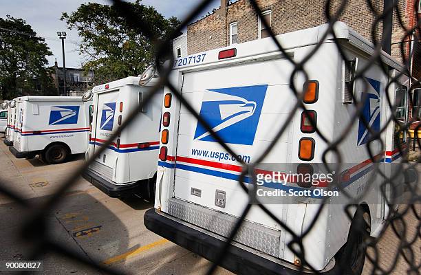 United States Postal Service trucks sit outside the Roberto Clemente Post Office August 25, 2009 in Chicago, Illinois. The Postal Service announced...