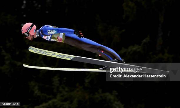 Manuel Fettner of Austria soars through the air during his qualification jump on day one of the Innsbruck 65th Four Hills Tournament on January 3,...