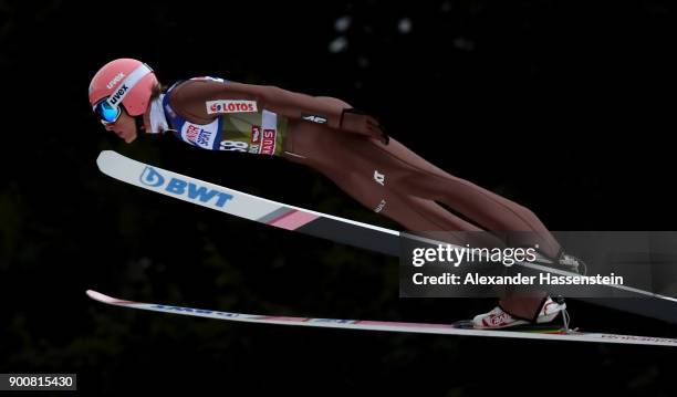 Dawid Kubacki of Poland soars through the air during his qualification jump on day one of the Innsbruck 65th Four Hills Tournament on January 3, 2018...