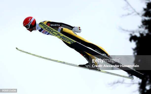 Markus Eisenbichler of Germany soars through the air during his qualification jump on day one of the Innsbruck 65th Four Hills Tournament on January...