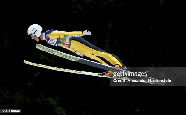 Junshiro Kobayashi of Japan soars through the air during his qualification jump on day one of the Innsbruck 65th Four Hills Tournament on January 3,...