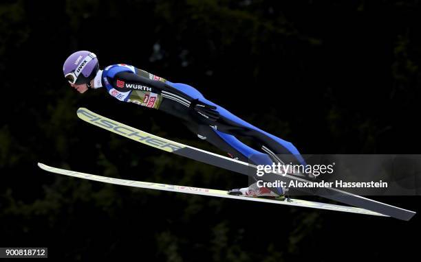 Andreas Wellinger of Germany soars through the air during his qualification jump on day one of the Innsbruck 65th Four Hills Tournament on January 3,...