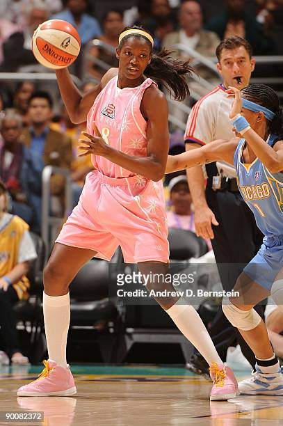 De Lisha Milton-Jones of the Los Angeles Sparks handles the ball against Tamera Young of the Chicago Sky on August 25, 2009 at Staples Center in Los...