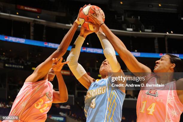 Tina Thompson and Lindsay Wisdom-Hylton of the Los Angeles Sparks blocks a shot against Candice Dupree of the Chicago Sky on August 25, 2009 at...