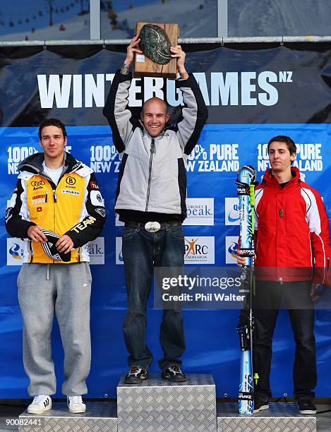 Silver medalist Felix Neureuther of Germany, gold medalist Jake Zamansky of the USA and bronze medalist Olivier Jenot of Monaco stand on the podium...