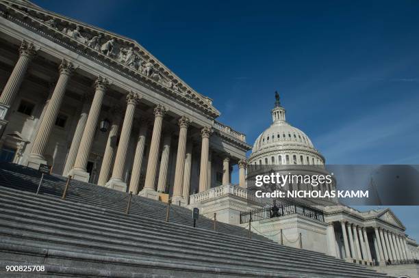 The US Capitol is seen in Washington, DC, on January 3, 2018 before the opening of the second session of the 115th Congress. - The US Congress hits...