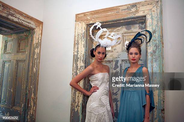 Model Ruby wearing an Ivory dress by Akira and model Ania wearing a turquoise dress by Leona Edmiston pose at the launch of Melbourne GPO's "Fashion...