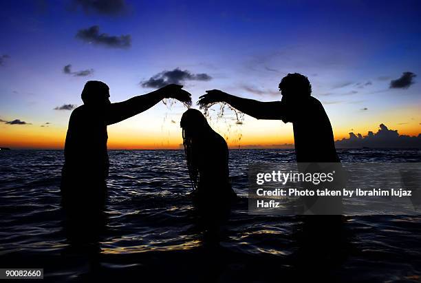 the pure bath - baptism girl stock pictures, royalty-free photos & images