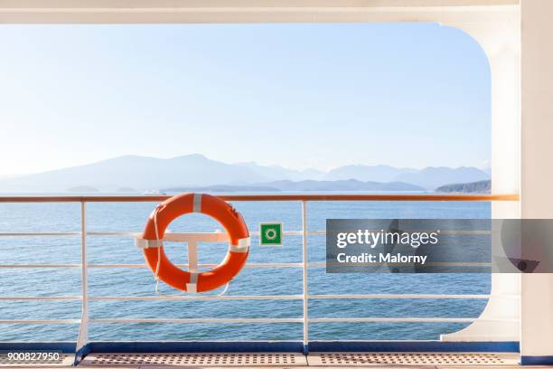 lifebelt at an outside deck of a cruise ship - vancouver, canada - railings 個照片及圖片檔