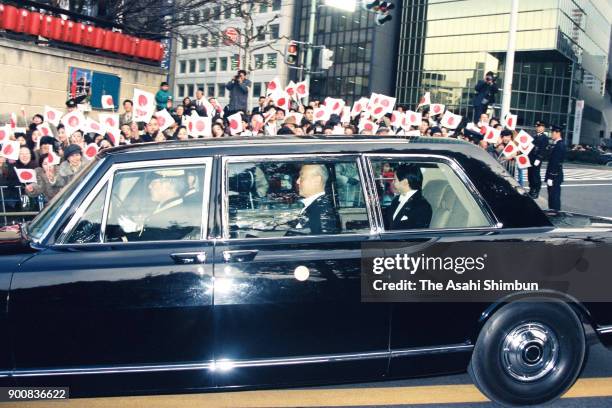 Crown Prince Naruhito is welcomed by well-wishers after the Ceremonial Investiture on February 23, 1991 in Tokyo, Japan.