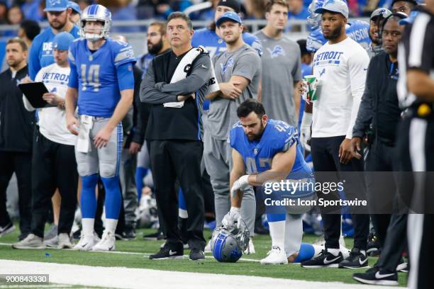 Detroit Lions linebacker Nick Bellore kneels on the sidelines during a game between the Green Bay Packers and the Detroit Lions on December 31, 2017...