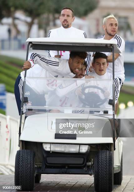 Kingsley Coman, Javi Martinez, James Rodriguez , Franck Ribery and Rafinha drive in a golf cart on their way to a training session on day 2 of the FC...