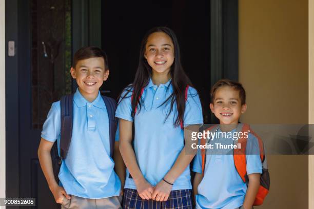 school children leaving the house - first day of school australia stock pictures, royalty-free photos & images
