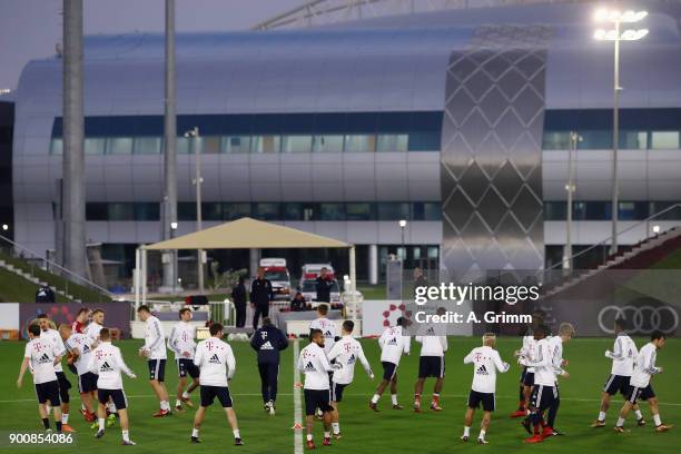 Players warm up during a training session on day 2 of the FC Bayern Muenchen training camp at ASPIRE Academy for Sports Excellence on January 3, 2018...