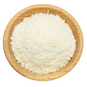 grated Parmesan cheese in wooden bowl on white background