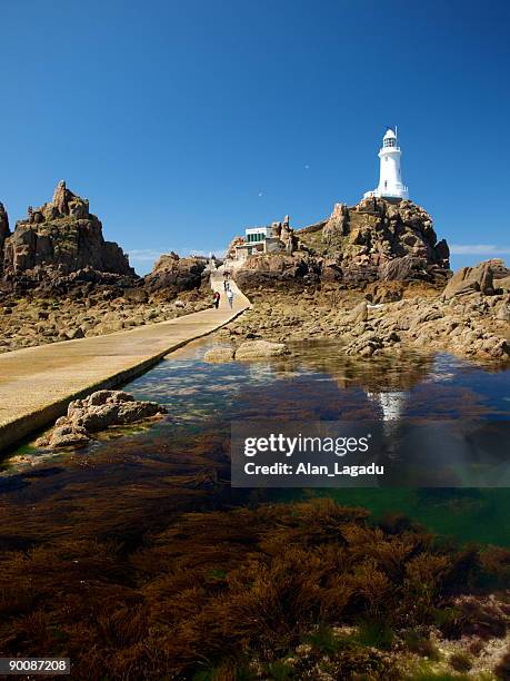 corbiere lighthouse, jersey. - jersey channel islands stock-fotos und bilder