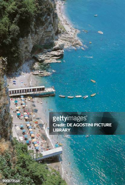 Beach and cliff on the sea, Vico Equense, Campania, Italy.